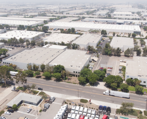 An industrial building sits among many