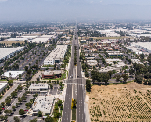 A view from the sky down a four lane road