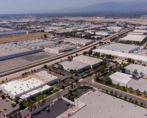 An industrial building sits among many